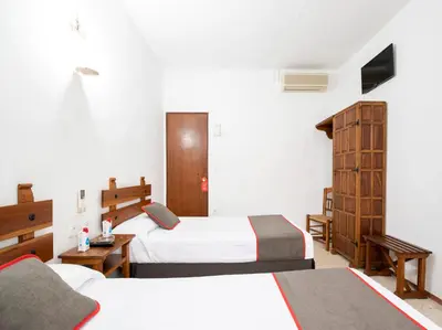 Cama o camas de una habitación en Hostal Santiago