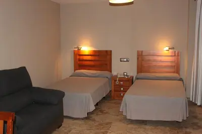 Cama o camas de una habitación en Hotel Peña Escrita