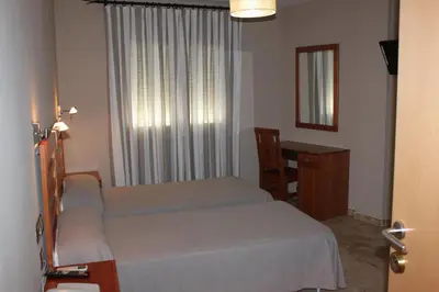 Cama o camas de una habitación en Hotel Peña Escrita