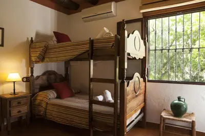 Cama o camas de una habitación en Cortijo La Algallumbilla
