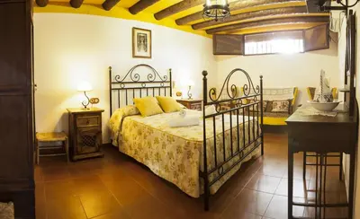 Cama o camas de una habitación en Cortijo La Algallumbilla