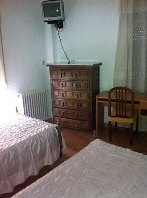 Cama o camas de una habitación en Pensión Ruiz
