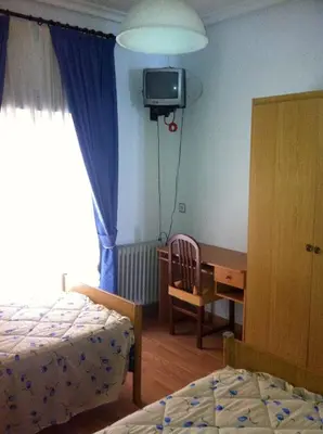 Cama o camas de una habitación en Pensión Ruiz