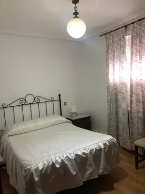 Cama o camas de una habitación en Pensión Ruiz
