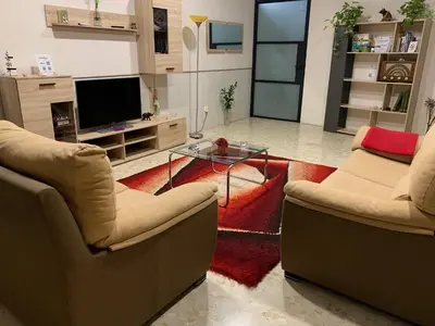 Una televisión o centro de entretenimiento en Apartamento Completo Regina