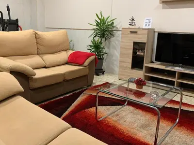 Una televisión o centro de entretenimiento en Apartamento Completo Regina