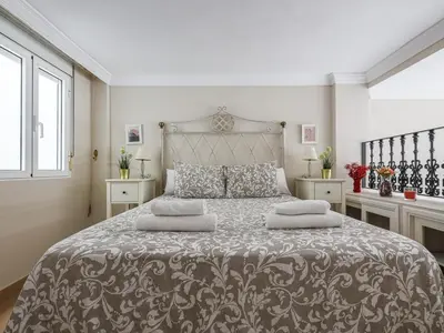 Cama o camas de una habitación en Sueños de Sevilla duplex a calidades