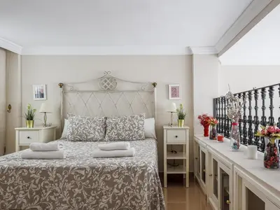 Cama o camas de una habitación en Sueños de Sevilla duplex a calidades