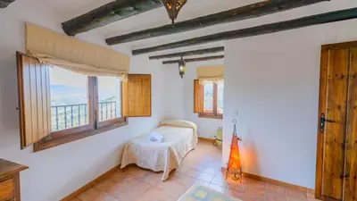Cama o camas de una habitación en Casa Dehesa de las Casas Algarinejo by Ruralidays