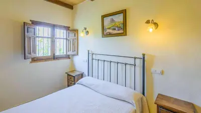 Cama o camas de una habitación en Villa el Establo Montefrio by Ruralidays