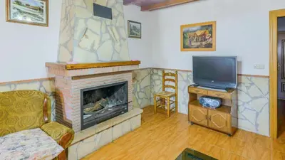 Una televisión o centro de entretenimiento en Casa El Mirador Montefrio by Ruralidays