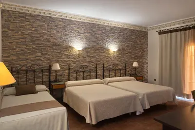 Cama o camas de una habitación en Hotel Trajano