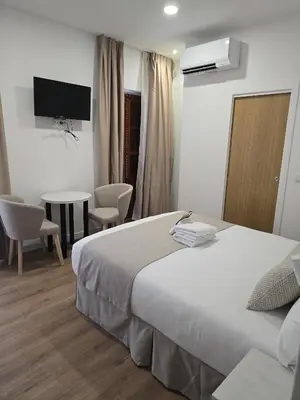 Cama o camas de una habitación en Le Petit Palü Sevilla
