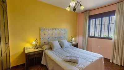 Cama o camas de una habitación en Casa Las Lomas de San Rafael Periana by Ruralidays