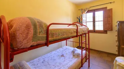 Cama o camas de una habitación en Cortijo Los Tulipanes Periana by Ruralidays