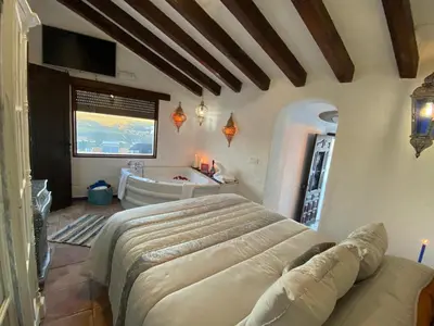Zona de estar de El Escondite de Martina, Áticos Románticos