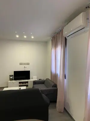 Una televisión o centro de entretenimiento en Alameda Urban Apartment