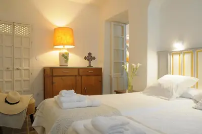 Cama o camas de una habitación en CASA LEÓN BLANCO CARMONA reformada céntrica con chimenea y terraza con vistas