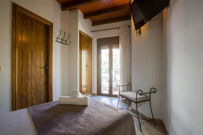 Cama o camas de una habitación en Hostal Valle Del Sol Alora