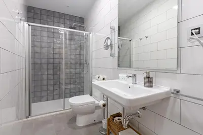 Un baño de Nine O Clock San Agustin Suites