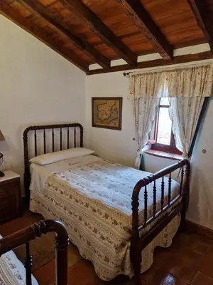 Cama o camas de una habitación en Colonos Alojamientos Rurales