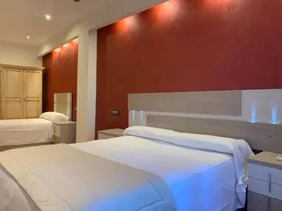 Cama o camas de una habitación en Hostal Poeta Machado