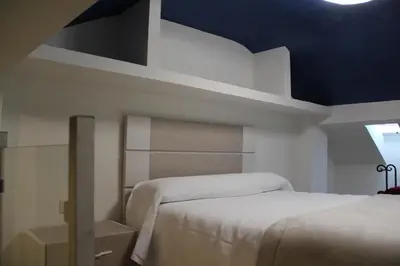 Cama o camas de una habitación en Hostal Poeta Machado