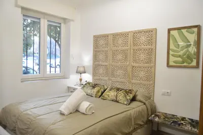 Cama o camas de una habitación en FLEMING Loft PARKING Tourist Córdoba