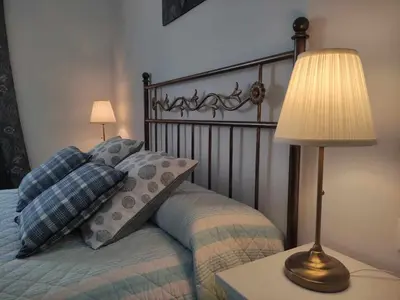 Cama o camas de una habitación en Casa Rural Era · 12 personas y mascotas · Córdoba