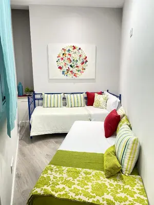 Cama o camas de una habitación en Alojamiento Hermanos Garnelo