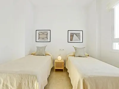 Cama o camas de una habitación en Apartamentos Santiago