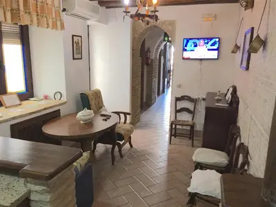 Una televisión o centro de entretenimiento en Casa Rural La Villa