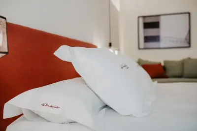 Cama o camas de una habitación en La Ermita Suites - Único Hotel Monumento de Córdoba