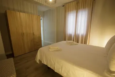 Cama o camas de una habitación en Ático Casa Lola