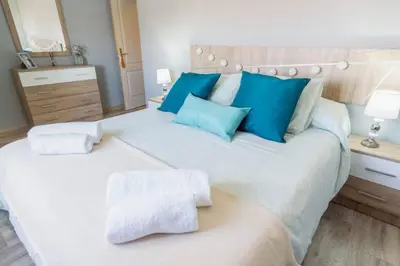 Cama o camas de una habitación en Pablo Neruda Tourist Home