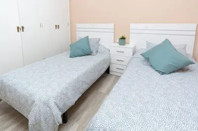 Cama o camas de una habitación en Pablo Neruda Tourist Home