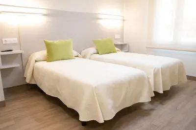 Cama o camas de una habitación en Hostal Restaurante el Cary