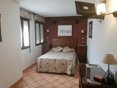Cama o camas de una habitación en Pensión Ana Pilar