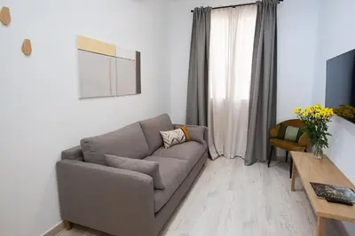 Una televisión o centro de entretenimiento en Azahar de Sevilla Apartments