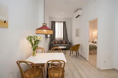 Cama o camas de una habitación en Azahar de Sevilla Apartments