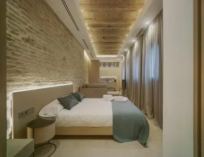 Cama o camas de una habitación en Apartamentos Los Patios del Pañuelo