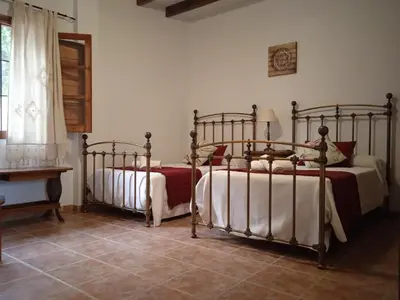 Cama o camas de una habitación en Apartamentos Vilo, Axarquía Rural