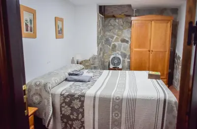 Cama o camas de una habitación en Casa Rural Arados