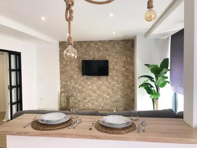 Una televisión o centro de entretenimiento en Vivienda Turística Jaén Interior PARKING GRATUITO