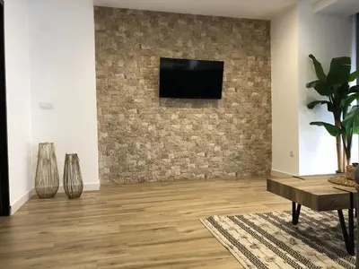 Una televisión o centro de entretenimiento en Vivienda Turística Jaén Interior PARKING GRATUITO