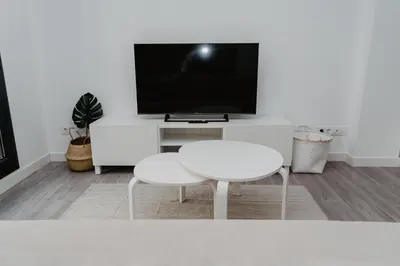 Una televisión o centro de entretenimiento en Charming loft next to wonders of Cordoba