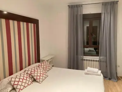 Cama o camas de una habitación en Ático dos dormitorios en el centro de Córdoba