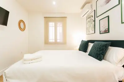 Cama o camas de una habitación en Alohamundi Puerta Osario