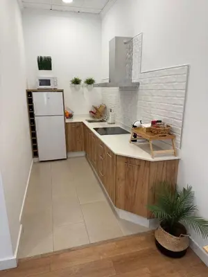 Una cocina o zona de cocina en APARTAMENTO TURISTICO LEO BAENA