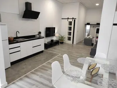 Una cocina o zona de cocina en APARTAMENTO TURISTICO LYRA BAENA